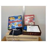 Two family board games, Yahtzee with unused score cards, the original Rummikub fast moving tile, rummy game 