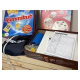 Two family board games, Yahtzee with unused score cards, the original Rummikub fast moving tile, rummy game 