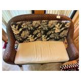 Wicker Loveseat with Floral Cushions