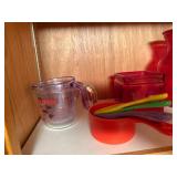 Assorted Kitchenware Collection with Mugs, Measuring Cups, and More