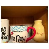 Assorted Kitchenware Collection with Mugs, Measuring Cups, and More