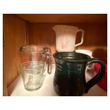 Assorted Kitchenware Collection with Mugs, Measuring Cups, and More