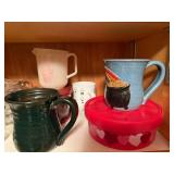 Assorted Kitchenware Collection with Mugs, Measuring Cups, and More