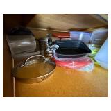 Assorted Collection of Kitchenware including Plates, Bowls, and Plastic Containers