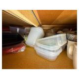 Assorted Collection of Kitchenware including Plates, Bowls, and Plastic Containers