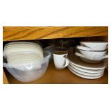 Assorted Collection of Kitchenware including Plates, Bowls, and Plastic Containers