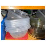 Assorted Collection of Kitchenware including Plates, Bowls, and Plastic Containers