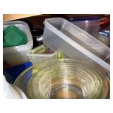 Assorted Collection of Kitchenware including Plates, Bowls, and Plastic Containers