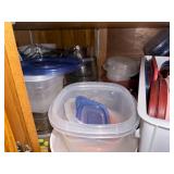 Assorted Collection of Kitchenware including Plates, Bowls, and Plastic Containers