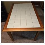 Wooden Dining Table with Tiled Top and Red Checkered Tablecloth
