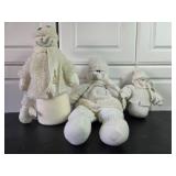 Collection of Holiday Decor Including Snowmen and Christmas Trees