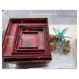 Collection of Holiday Decor: Red Themed Candle Holders, Nested Gift Boxes, and Wall Ornament