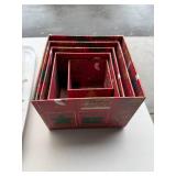 Collection of Holiday Decor: Red Themed Candle Holders, Nested Gift Boxes, and Wall Ornament