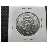 1969 D High Grade Kennedy Half Au or Better