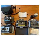 Collection of 4 Vintage Polaroid Cameras with Accessories