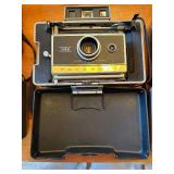 Collection of 4 Vintage Polaroid Cameras with Accessories