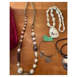 Collection of Costume Jewelry Necklaces and Bracelets with Metallic Pink Bag