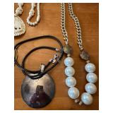 Collection of Costume Jewelry Necklaces and Bracelets with Metallic Pink Bag