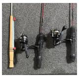 Six Fishing Poles with Two Red Wolf Reels