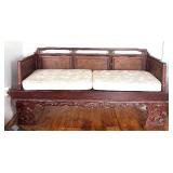 Vintage Opium Bed with Intricate Carvings and Cushions