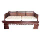 Vintage Opium Bed with Intricate Carvings and Cushions