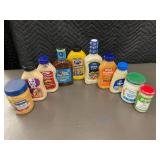 NE 1 - Collection of Assorted Condiments Including Aioli, Mayo, and Dressing