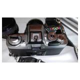 Minolta (2) and Cannon Camera, Tripod, lenses and more.