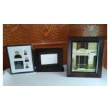 Assorted Picture frames in Sterilite 66 qt. Covered Tote