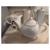 Collection of 4 Ceramic Pitchers and Teapots Featuring Vintage Designs