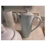 Collection of 4 Ceramic Pitchers and Teapots Featuring Vintage Designs