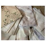 Collection of Vintage Table Linens with Embroidery and Damask Patterns