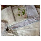 Collection of Vintage Table Linens with Embroidery and Damask Patterns