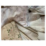 Collection of Vintage Table Linens with Embroidery and Damask Patterns