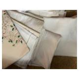 Collection of Vintage Table Linens with Embroidery and Damask Patterns