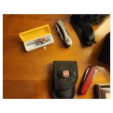 Assortment of Watches, Blood Oximeter, Pocket Knives, and Wallet