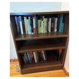 Wooden Bookshelf with Assorted Books Collection