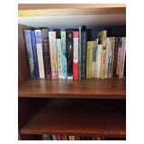 Wooden Bookshelf with Assorted Books Collection