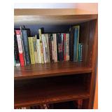 Wooden Bookshelf with Assorted Books Collection