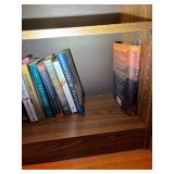 Wooden Bookshelf with Assorted Books Collection
