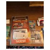 Office Supplies Including Brother Label Maker, Envelopes, and Ativa Paper Shredder