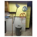 Set of Household Brooms, Extension Cords, and Metal Trash Can