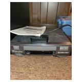 Cabinet with LG Blu-ray Player and Sylvania DVD Player with Remote Controls