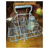 Collection of Kitchenware: Glass Bottles, Baskets, and Decorative Vases