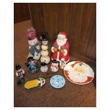 Assorted Christmas Decor Collection Including Santa Statues and Snowmen