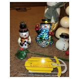 Assorted Christmas Decor Collection Including Santa Statues and Snowmen