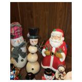 Assorted Christmas Decor Collection Including Santa Statues and Snowmen