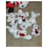 Collection of Holiday Stuffed Toys Including Santa, Snowman, and Bears