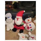 Collection of Holiday Stuffed Toys Including Santa, Snowman, and Bears