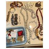 Collection of Vintage Jewelry Including Necklaces, Bracelets, and Pins