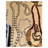 Collection of Vintage Jewelry Including Necklaces, Bracelets, and Pins